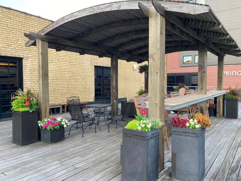 Terrace with planters full of colorful flowers
